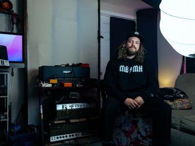 Alex Cutler sitting next to audio tools.