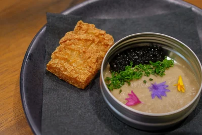 Toro pâté with caviar set over a wasabi hash brown. 
