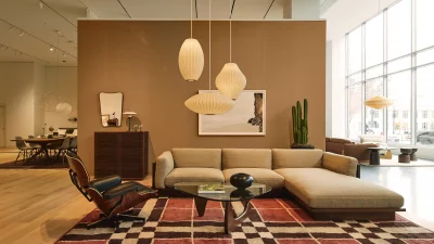 A full living room set with coffee table, couch and light fixtures.