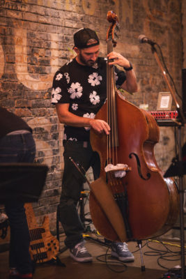 Alex Rowe plays upright bass at Hopkins Brewery's live jazz night