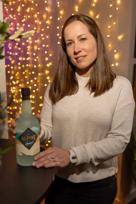 Sara Sergent posing with Alpine Distilling gin