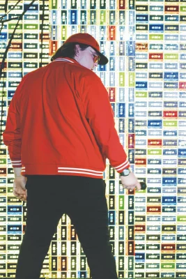 A man in red with his back to the camera