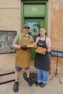 Brent and Mia Knudson standing outside F'Kosh