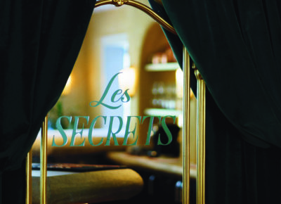 Vinyl window sign "Les Secrets" at La Caille's new bar
