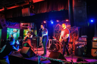 The Apathetics playing in front of a packed bar.