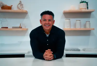Ricardo Pazos leaning over a granite countertop
