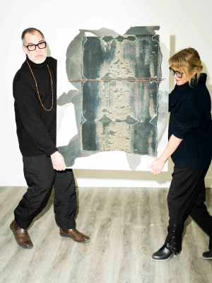 Colour Maisch and Jorge Rojas of Material Gallery hold a painting