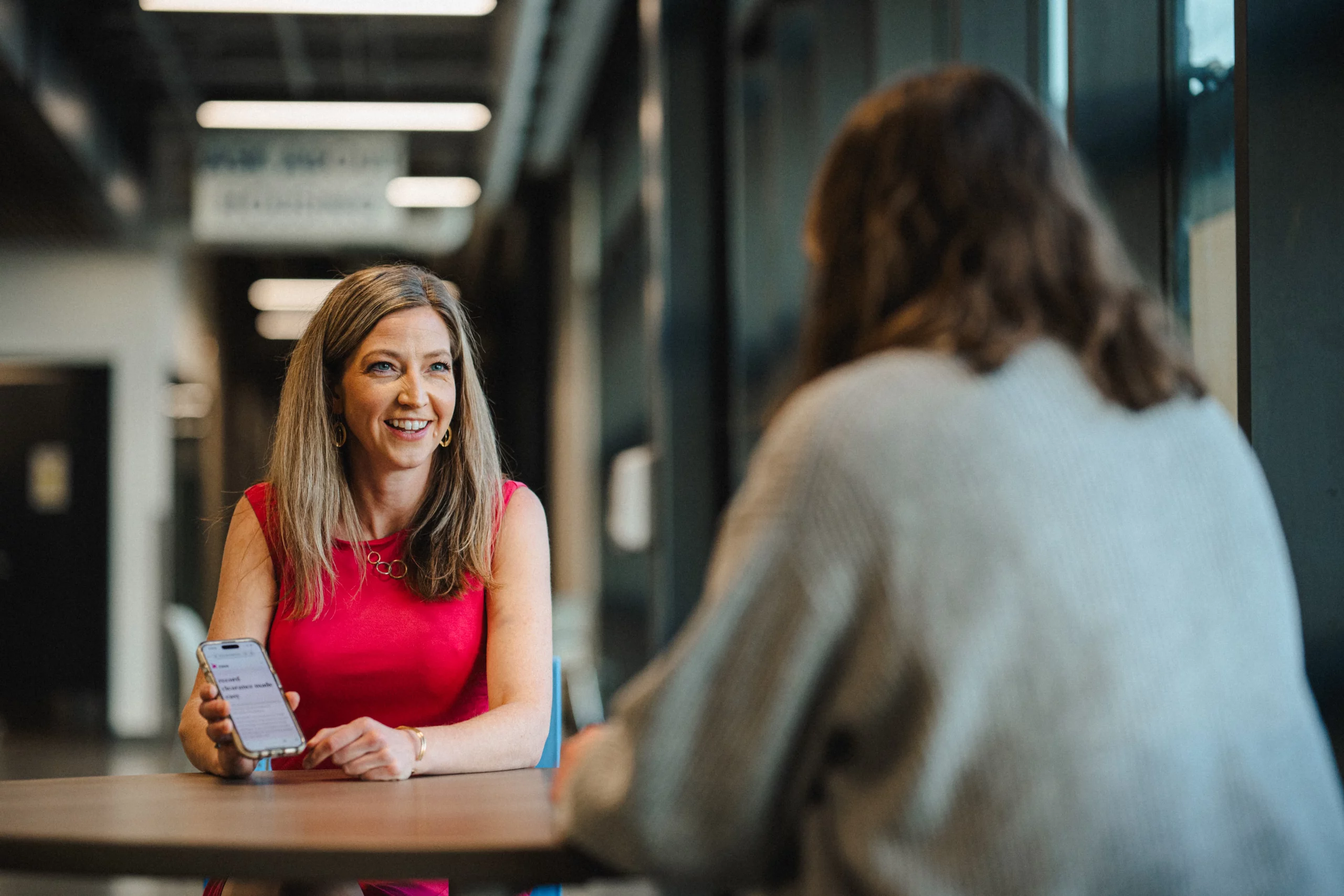Noella Sudbury of Rasa Legal chats with a client. Photo: Austen Diamond Photography