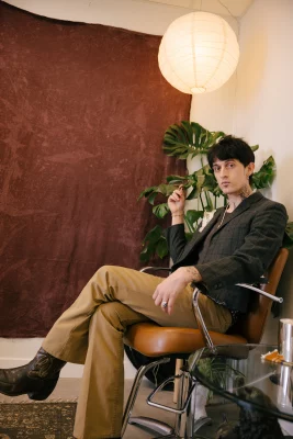 Graves sitting on a barber chair.