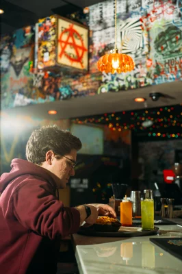 Hans Magleby eats the chili dog at SLC Pub