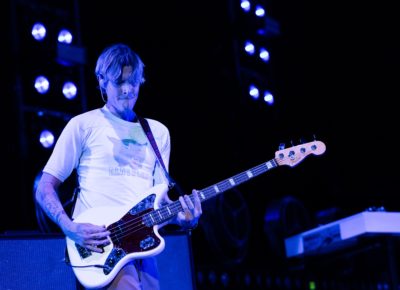 Daniel Tichenor playing bass with Cage the Elephant on stage in Salt Lake City. Photo: @lmsorenson