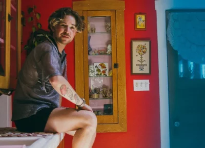 Peter sitting in a counter.