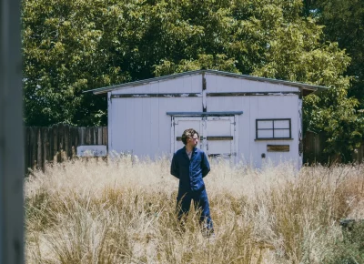 Peter standing in a field.