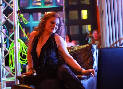 Co-owner/founder Katie Peterson performing with the chair that has been with the company from the start.