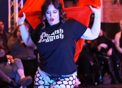 Co-owner Ann Crowther takes the stage with their aerial silks.