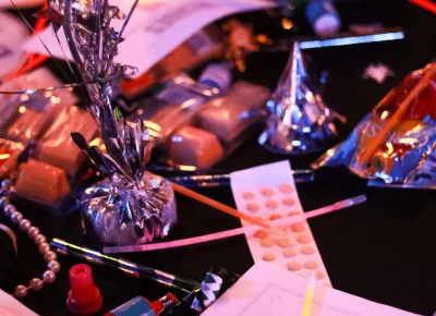 Party favors line the tables at The Salt Mine's anniversary.