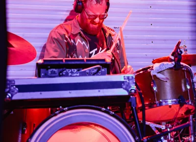 A drummer playing on stage with musician Samantha Crain in Salt Lake City at the venue Kilby Court on June 30.