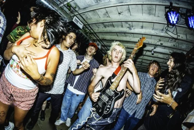 @mitchy.quick from Backhand carrying his guitar at Had A Great Summer (H.A.G.S.) Festival at Salt Lake City