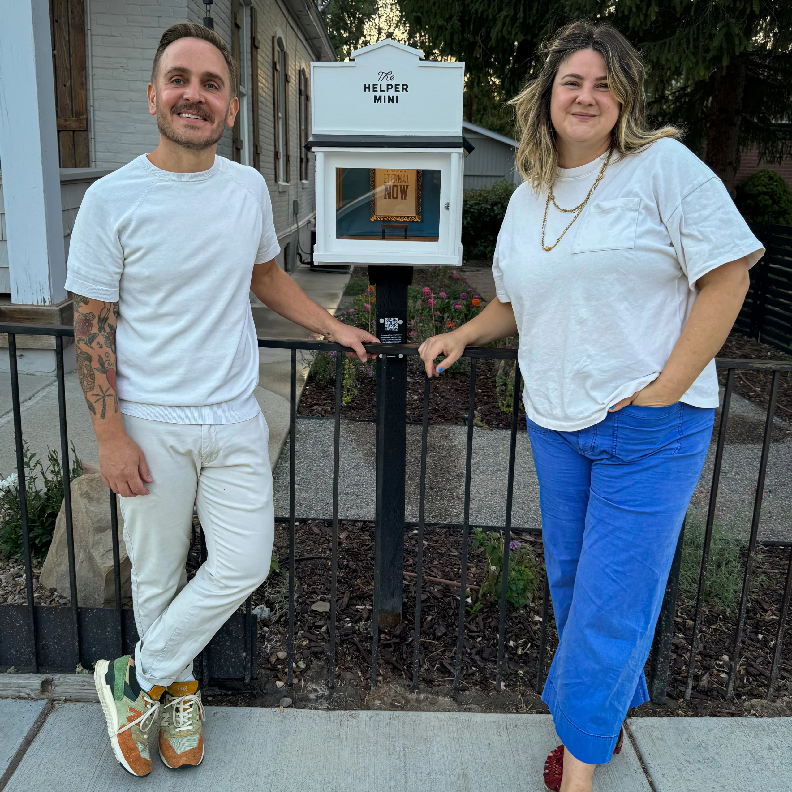 (L-R) Kevin Perry and Alana Twelmeyer standing in front of the Helper Mini.