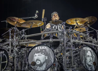 Charlie Benante is having fun on the drums.