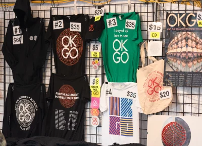 The venues’ merch tent gets a consistent drip of people looking to snag their favorite designed T’s and maybe an album if they have not picked up already.