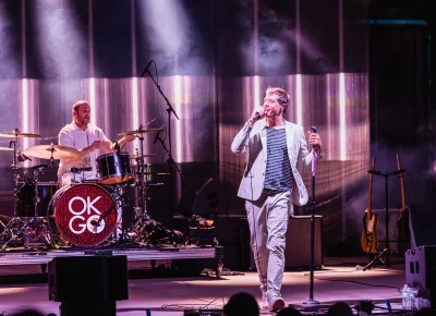 Lead singer Damian Kulash (right) and Drummer Dan Konopka (left) of OK Go on stage at the Red Butte Garden Amphitheatre.