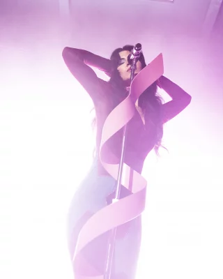 MARINA at the microphone.