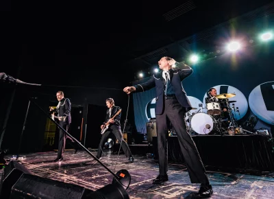 The Hives’ Pelle Almqvist throws the mic and the stand with it towards the audience while on stage at the Union Event Center in Salt Lake City, UT.