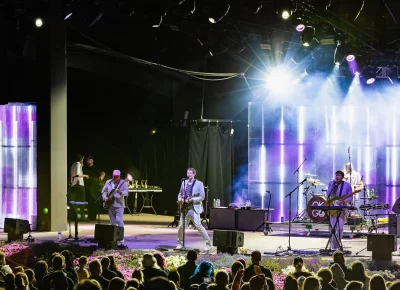 OK Go, celebrating their new album release with a show at the Red Butte Garden Amphitheatre with audience members just feet away beyond the flowers.