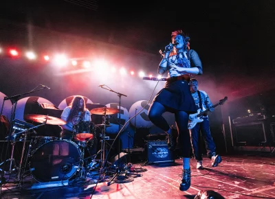 Snõõper band members playing on stage at The Union Event Center in SLC, UT.