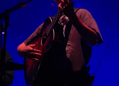 Big Thief principal vocalist and acoustic guitar player Adrianne Lenker sings and plays guitar on stage at Library Square in Salt Lake City for SLC Twilight on Sept. 22.