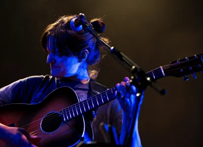 Big Thief lead singer and acoustic guitar player Adrianne Lenker plays guitar on stage at Library Square in Salt Lake City for SLC Twilight on Sept. 22.