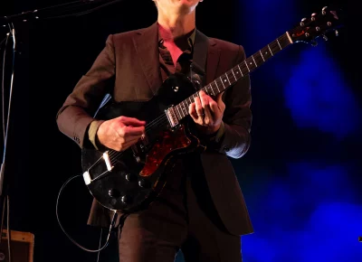 Big Thief guitarist and vocalist Buck Meek plays guitar on stage at Library Square for SLC Twilight.