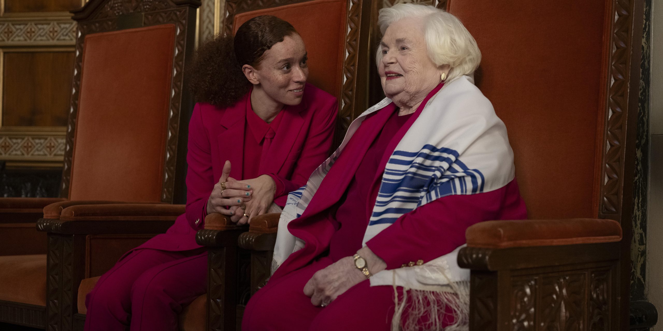 Two women sitting in a chair.