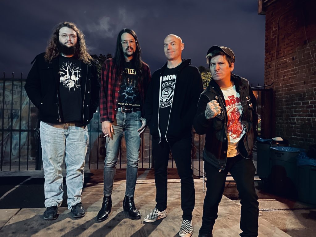 Four guys standing around.