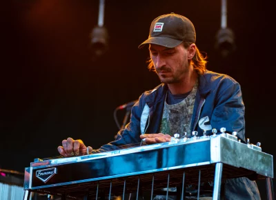 The keyboard player for musician Kiki Cavazos on stage at Library Square for SLC Twilight.
