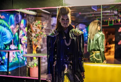 Man standing in front of mirror.