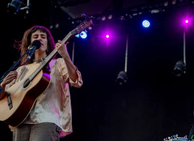 Little Moon singer Emma Hardyman plays guitar and sings on stage at Library Square for SLC Twilight.