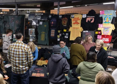 Huge tables of T-shirts, albums and even throws for sale at the merch table at the UCCU Center filled with all the Kevin Morby and Lord Huron goodness to be had.