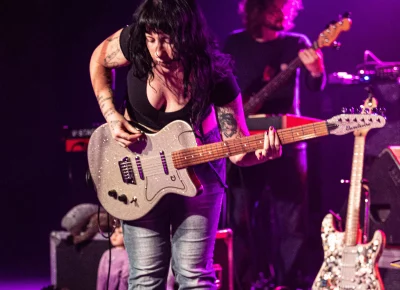 Hartzman's shredded through the show on her guitar.