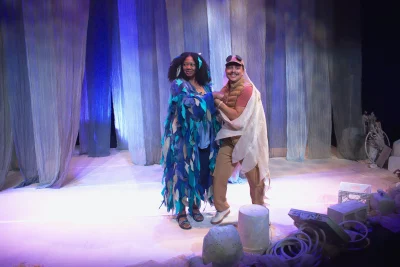 Cameron and Faatau dancing on stage.