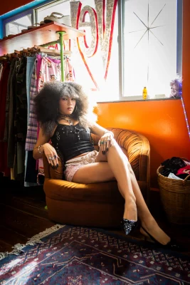 Adaline Rae lounging in a chair.