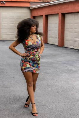 Adaline Rae strutting in a colorful dress.