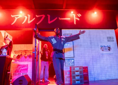 Freddie Gibbs comes out of the faux Asian food joint set on stage for his show at The Union with producer The Alchemist on Nov. 1.