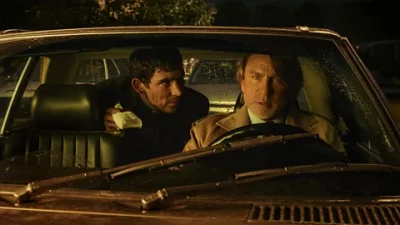 Daniel Craig and Josh O'Connor sit in a car in Rian Johnson's Wake Up Dead Man: A Knives Out Mystery. Photo: BBC.