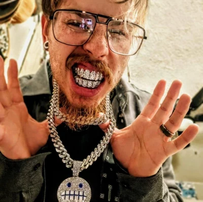 Utah based rapped Dre Rage Tv smiles with his bling.