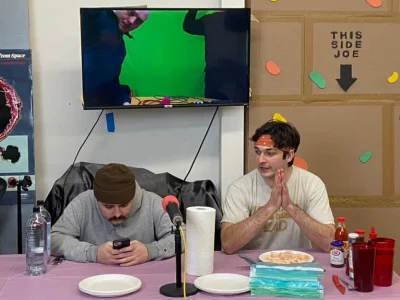 Podcast About List eating shrimp at a table