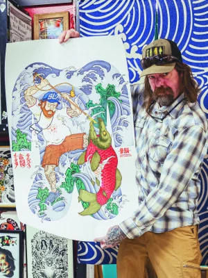 Nate Drew showing off some tattoo artwork.