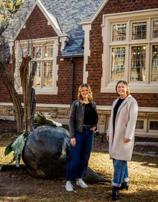 Finlayson and Morgan from Elevate stand in front of a building.