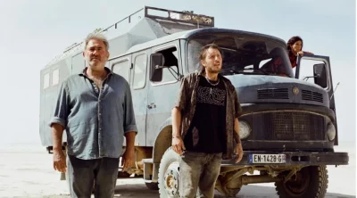 Sergi Lopez standing in front of a truck in Sirāt by Oliver Laxe